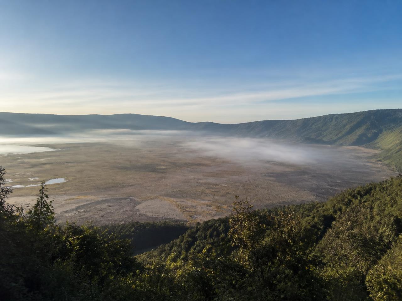 Morning mist over the vast floor of the Ngorongoro Crater